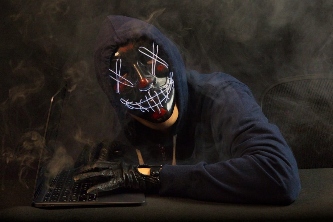 Cybersecurity professional monitoring threats on a laptop